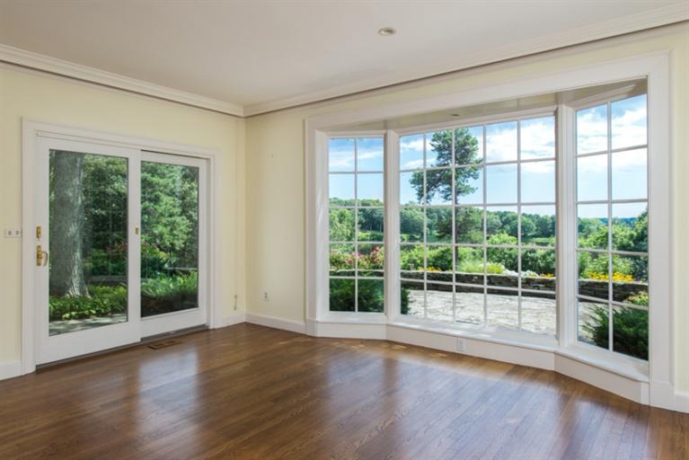 185 Ice Valley Road Osterville, MA 02655 - Photo 4 of 22 a view of a room with wooden floor and balcony