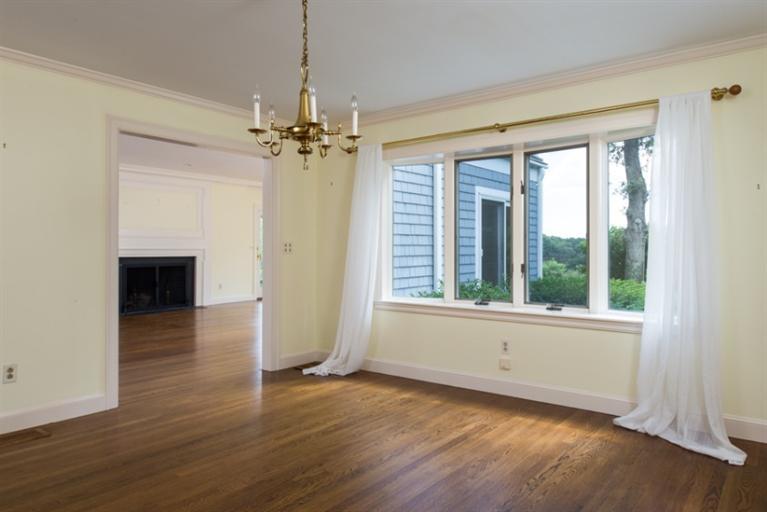 185 Ice Valley Road Osterville, MA 02655 - Photo 5 of 22 a view of an empty room with a window and wooden floor