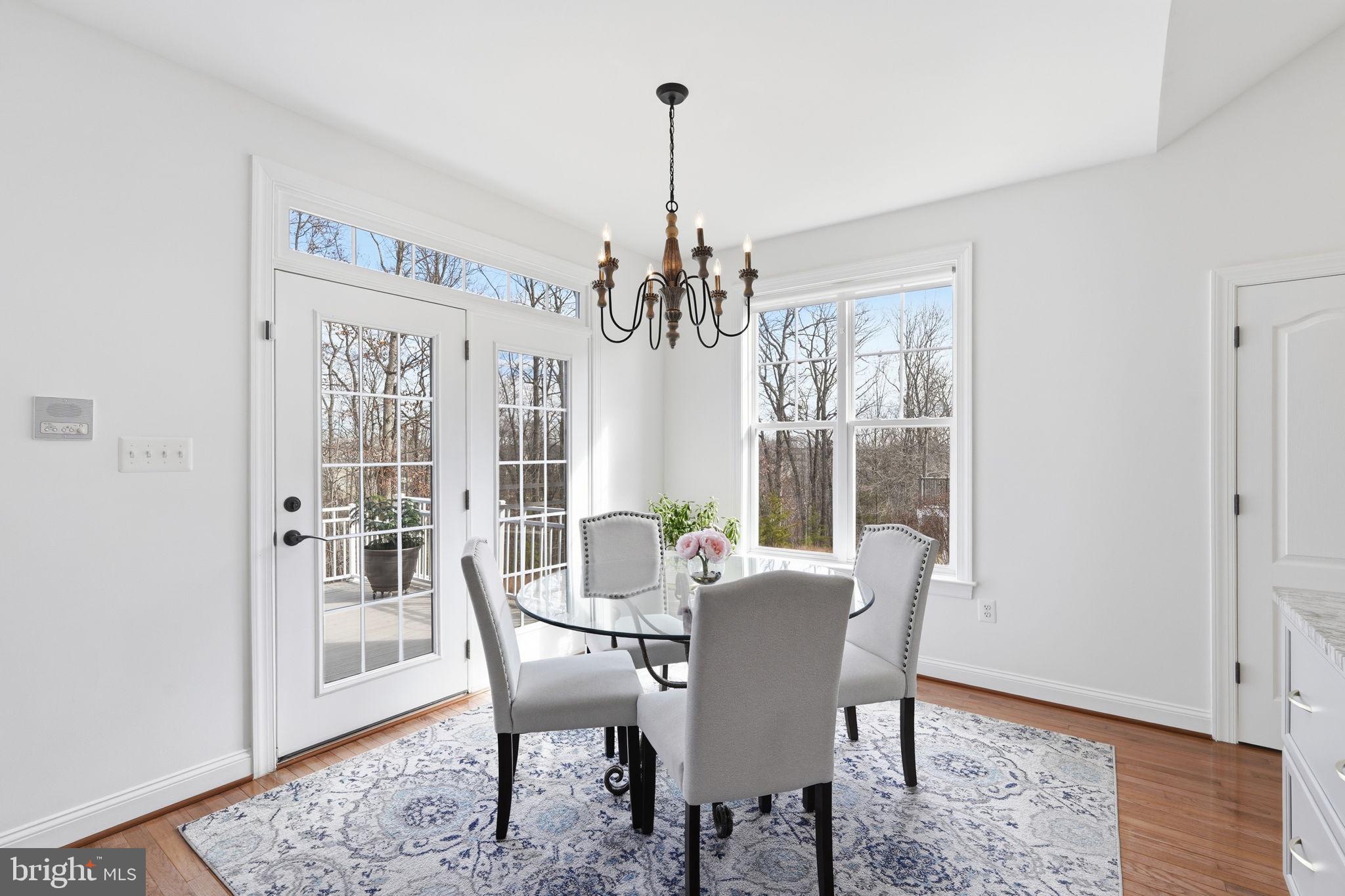105 Turnstone Lane White Post, VA 22663 - Photo 11 of 77 a view of a dining room with furniture window and wooden floor