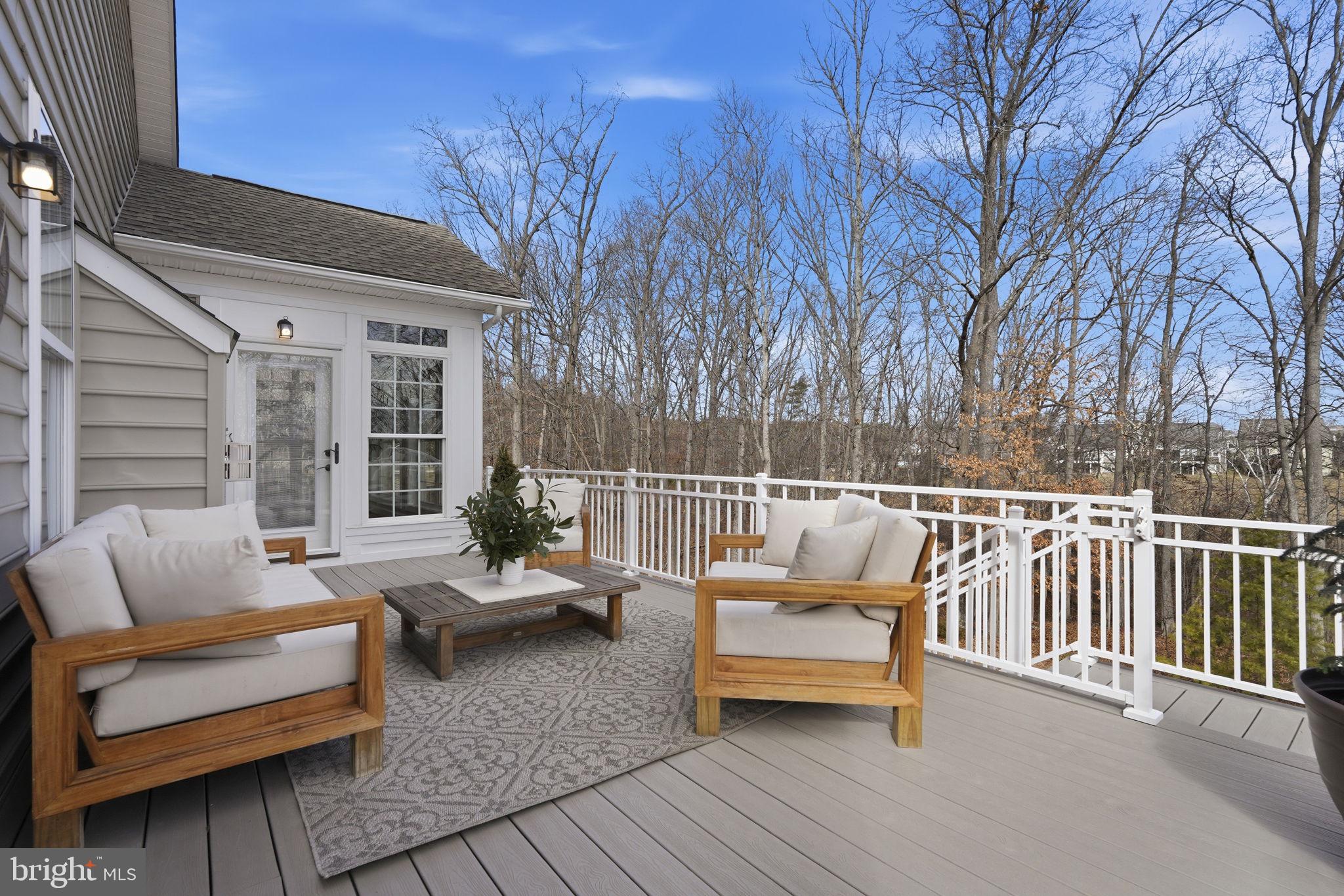 105 Turnstone Lane White Post, VA 22663 - Photo 15 of 77 a view of a roof deck with couches and wooden fence