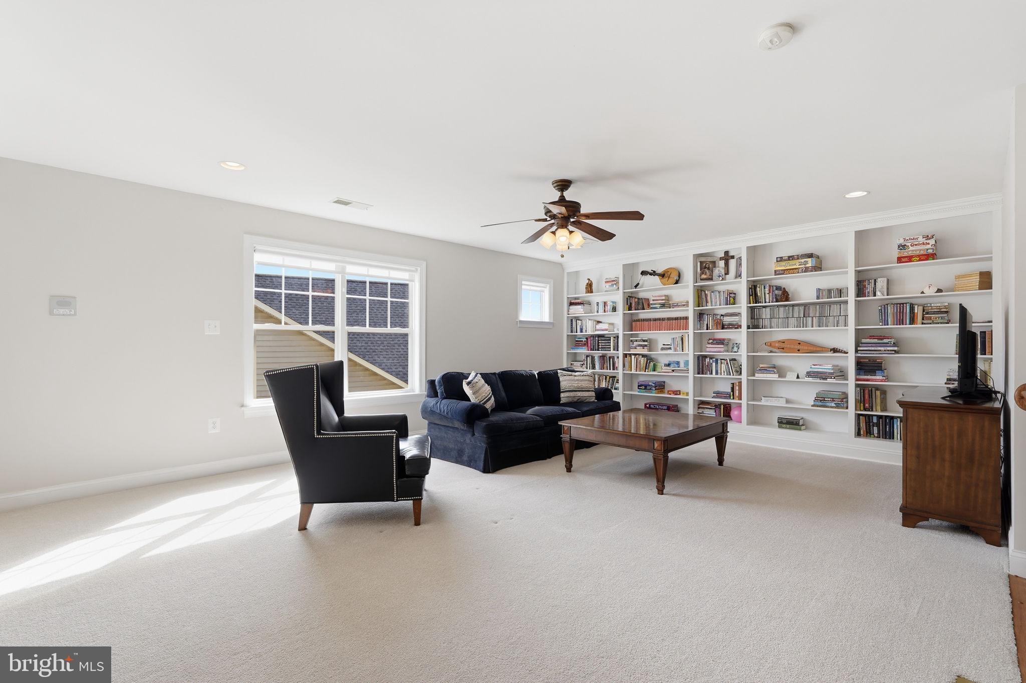 105 Turnstone Lane White Post, VA 22663 - Photo 24 of 77 a living room with furniture and a bookshelf