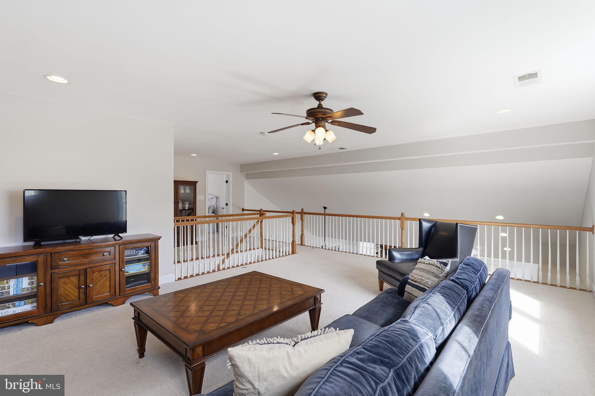 105 Turnstone Lane White Post, VA 22663 - Photo 25 of 77 a living room with furniture and a flat screen tv
