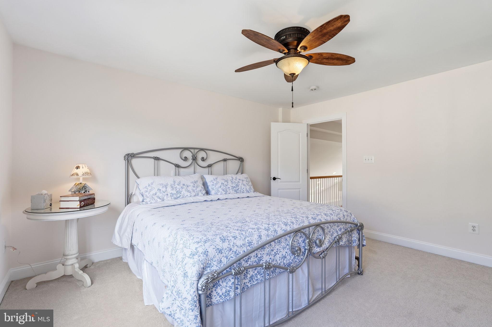 105 Turnstone Lane White Post, VA 22663 - Photo 26 of 77 a bedroom with a bed and a table in it