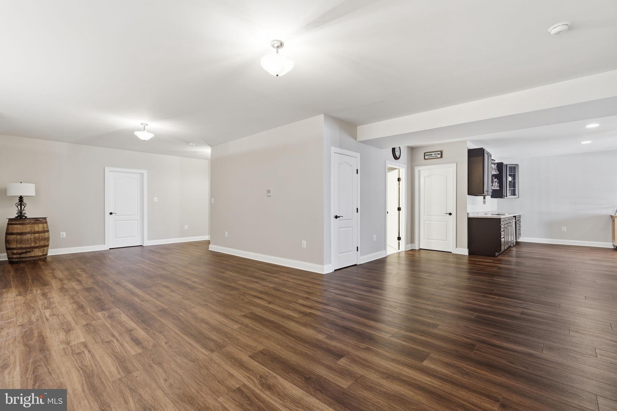 105 Turnstone Lane White Post, VA 22663 - Photo 29 of 77 a view of empty room with wooden floor and fireplace