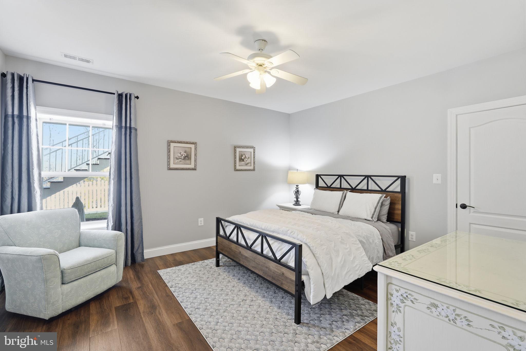 105 Turnstone Lane White Post, VA 22663 - Photo 31 of 77 a spacious bedroom with a bed and a couch