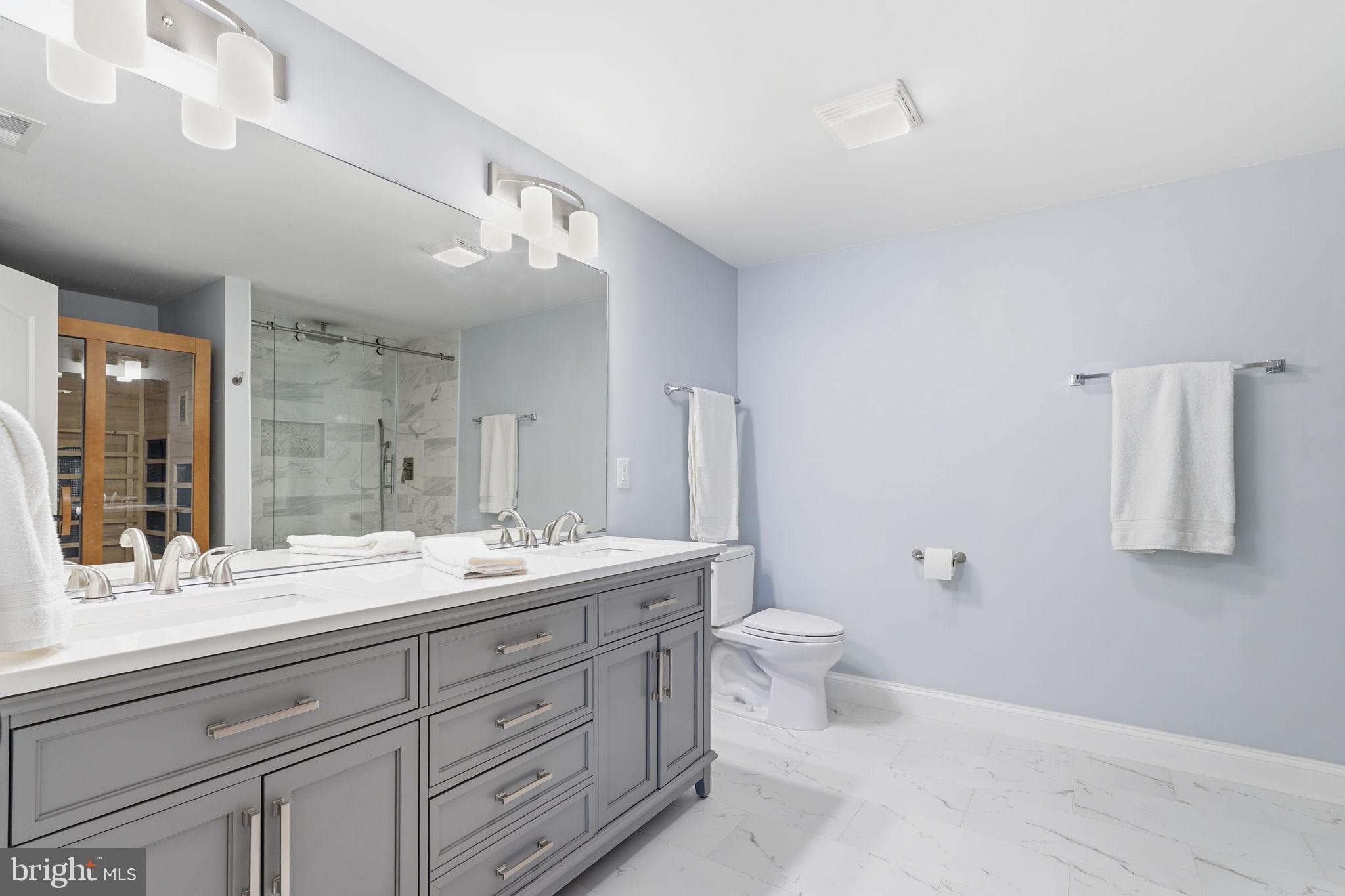 105 Turnstone Lane White Post, VA 22663 - Photo 32 of 77 a bathroom with a double vanity sink mirror and toilet