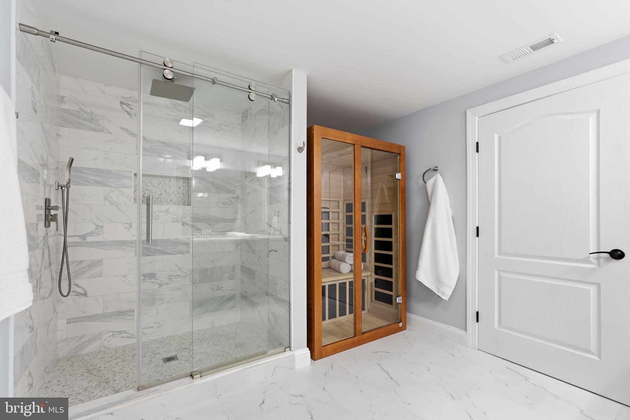 105 Turnstone Lane White Post, VA 22663 - Photo 33 of 77 a bathroom with a shower and a glass door