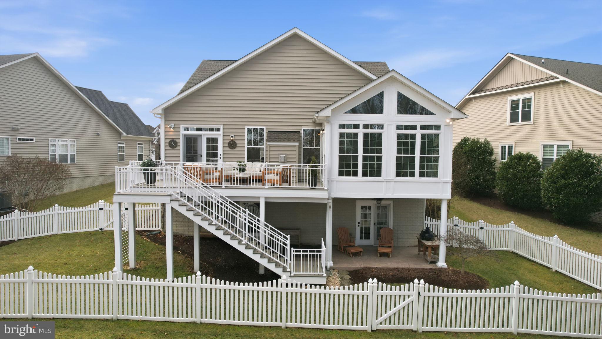 105 Turnstone Lane White Post, VA 22663 - Photo 42 of 77 a view of a house with wooden deck and a floor to ceiling window