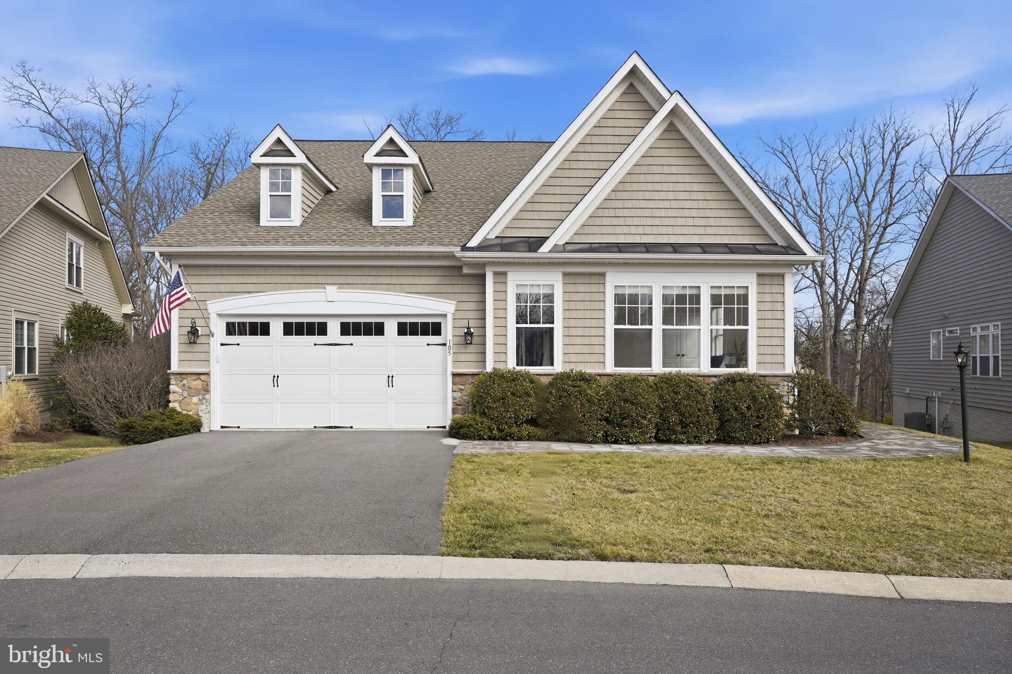 105 Turnstone Lane White Post, VA 22663 - Photo 47 of 77 a front view of a house with a yard and garage