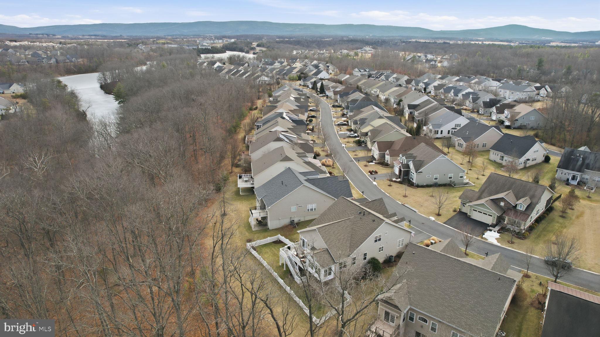105 Turnstone Lane White Post, VA 22663 - Photo 5 of 77 an aerial view of a house with a lake