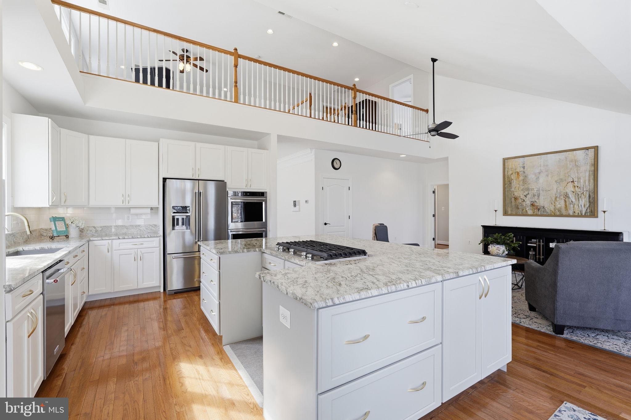 105 Turnstone Lane White Post, VA 22663 - Photo 8 of 77 a kitchen with a refrigerator a sink and dishwasher with wooden floor