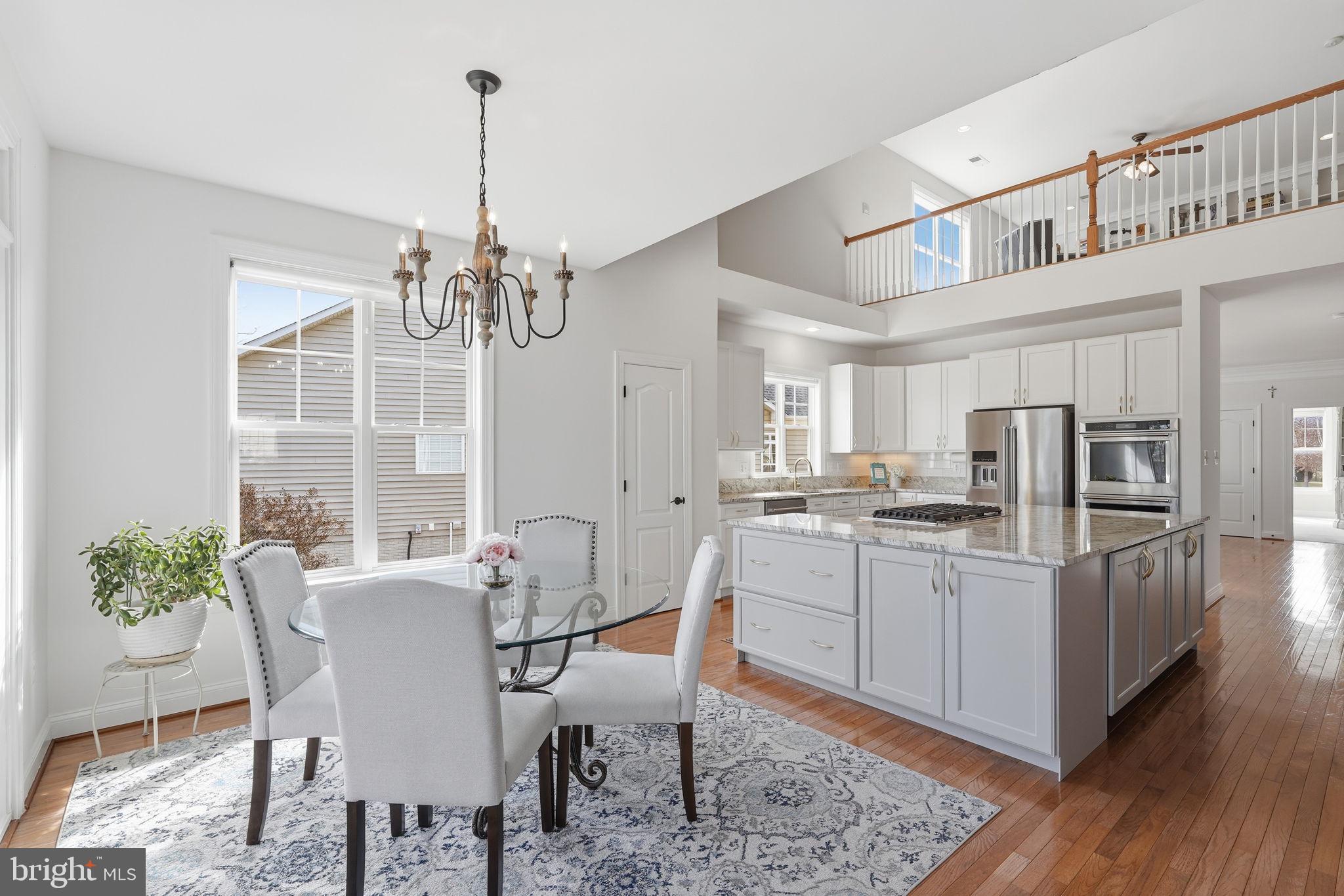 105 Turnstone Lane White Post, VA 22663 - Photo 10 of 77 a view of a dining room with furniture window and wooden floor