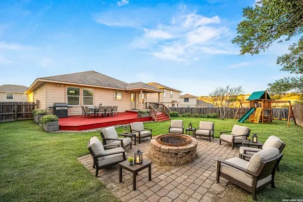 a view of an house with swimming pool and outdoor seating