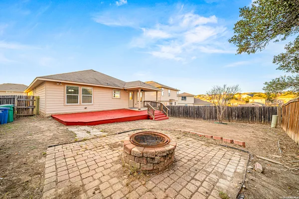a view of a backyard of the house