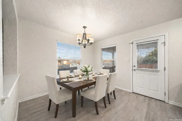 a view of a dining room with furniture window and wooden floor