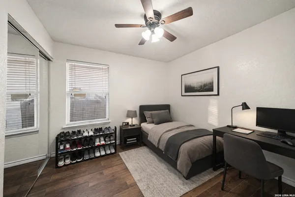 a bedroom with bed and a window