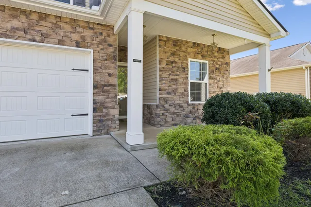 a bathroom with a tub shower vanity and a sink