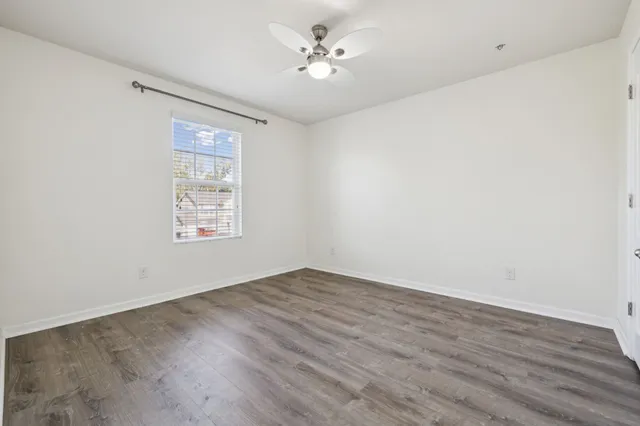a view of room with wooden floor