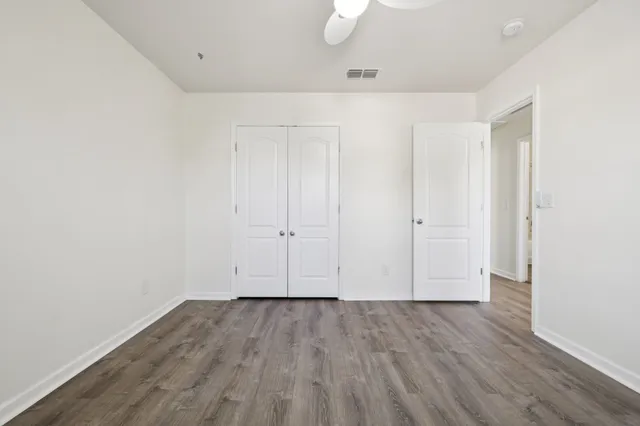 a view of a porch with a table and chairs