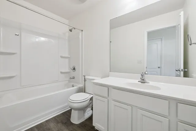 a view of a house with backyard porch and garden