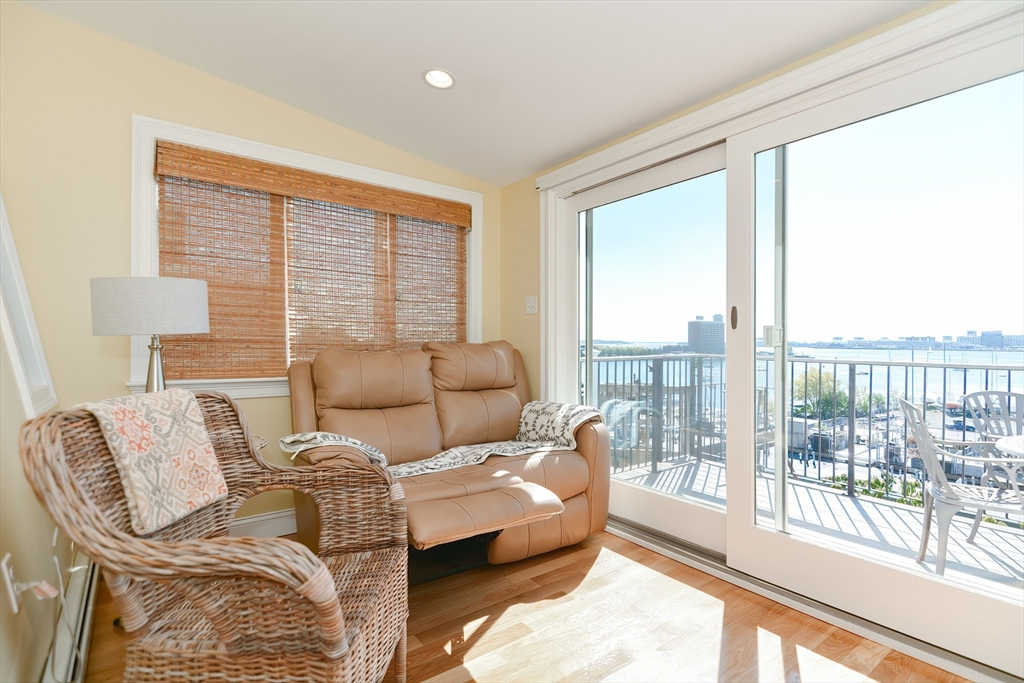 269 Webster Street, Unit 4 Boston, MA 02128 - Photo 15 of 36 a living room with furniture and a large window
