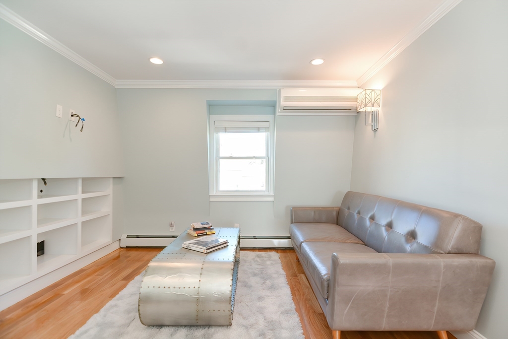 269 Webster Street, Unit 4 Boston, MA 02128 - Photo 19 of 36 a living room with furniture and a couch