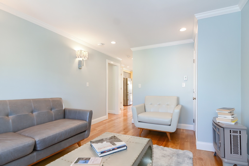 269 Webster Street, Unit 4 Boston, MA 02128 - Photo 20 of 36 a living room with furniture and a couch