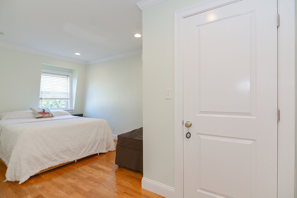 269 Webster Street, Unit 4 Boston, MA 02128 - Photo 23 of 36 a bedroom with a bed and a window