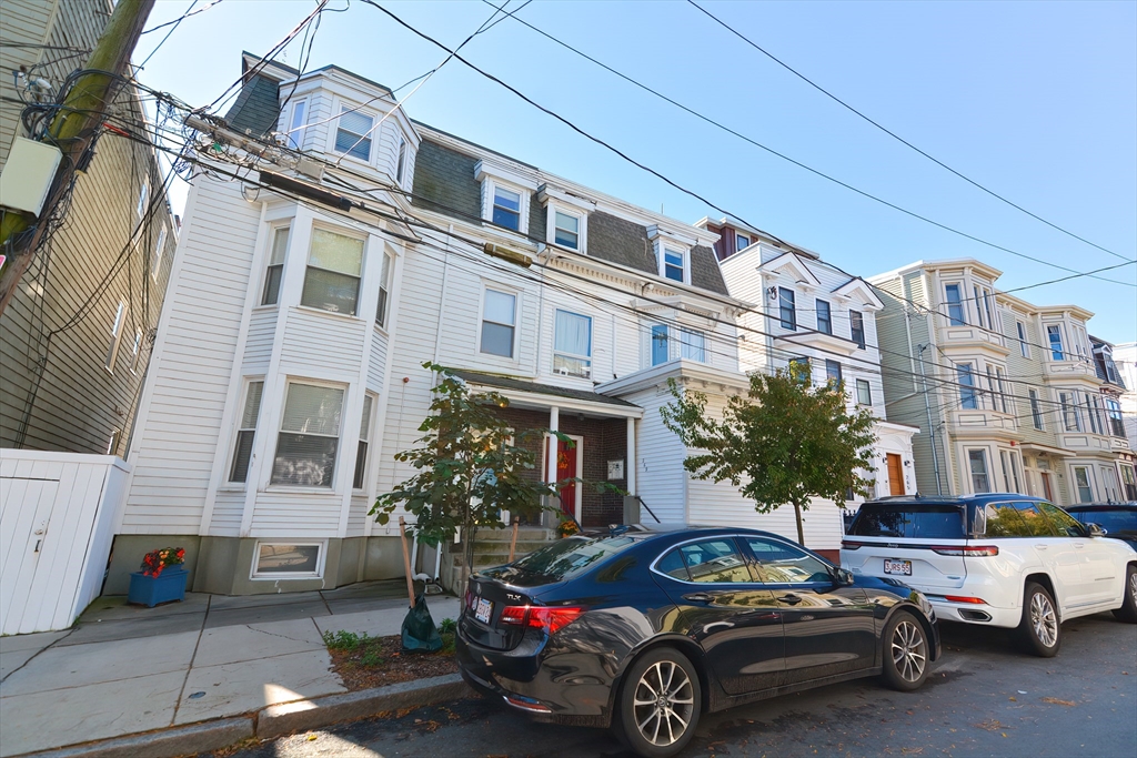 269 Webster Street, Unit 4 Boston, MA 02128 - Photo 28 of 36 a car parked in front of a building