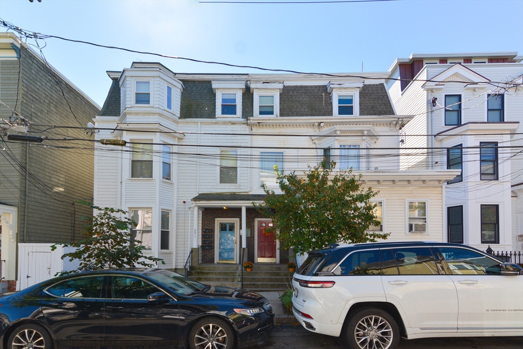 269 Webster Street, Unit 4 Boston, MA 02128 - Photo 29 of 36 a front view of a house with parking space