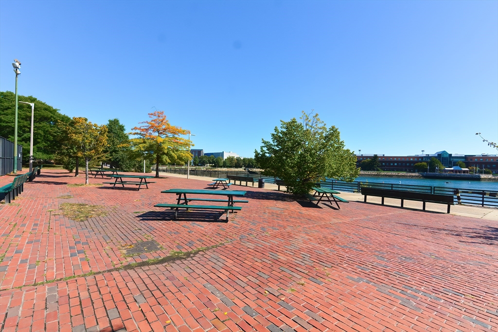 269 Webster Street, Unit 4 Boston, MA 02128 - Photo 31 of 36 a swimming pool with outdoor seating