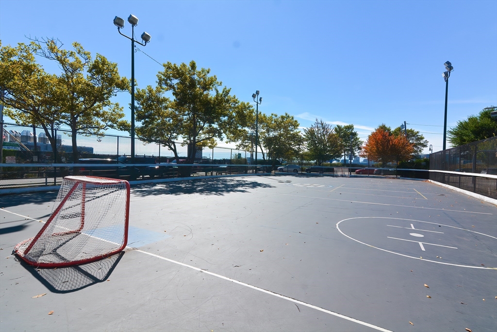 269 Webster Street, Unit 4 Boston, MA 02128 - Photo 34 of 36 a view of a swimming pool with a yard