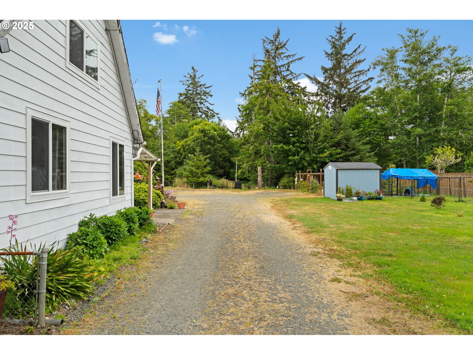 472 7th Avenue Hammond, OR 97121 - Photo 18 of 32 a view of a house with a yard