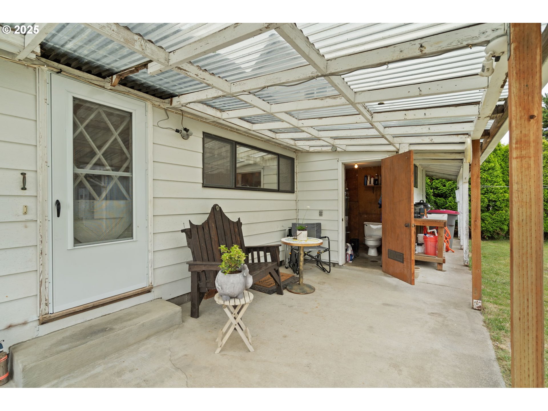 472 7th Avenue Hammond, OR 97121 - Photo 20 of 32 a dining room with furniture and a flat screen tv