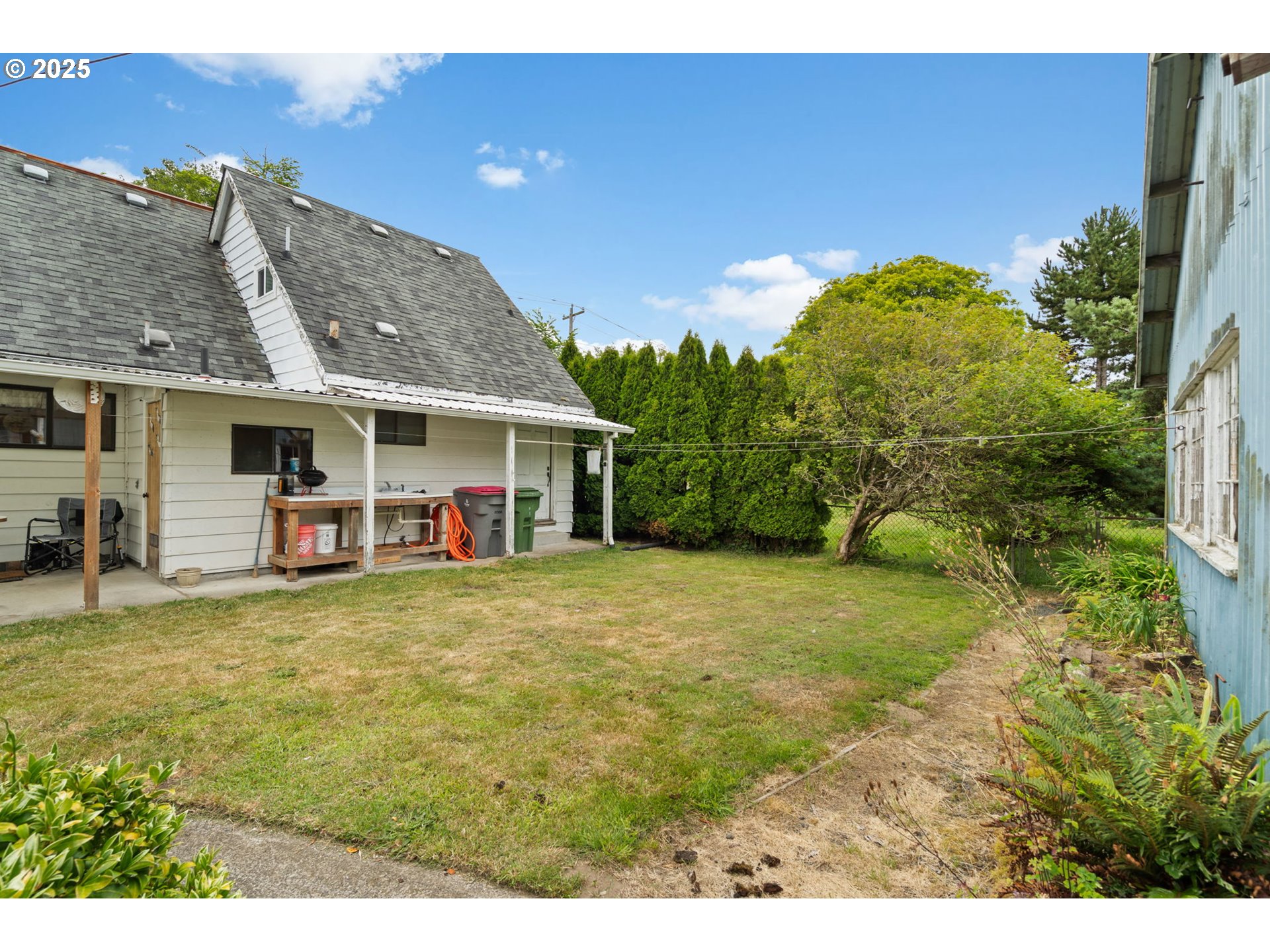 472 7th Avenue Hammond, OR 97121 - Photo 21 of 32 a front view of a house with a garden