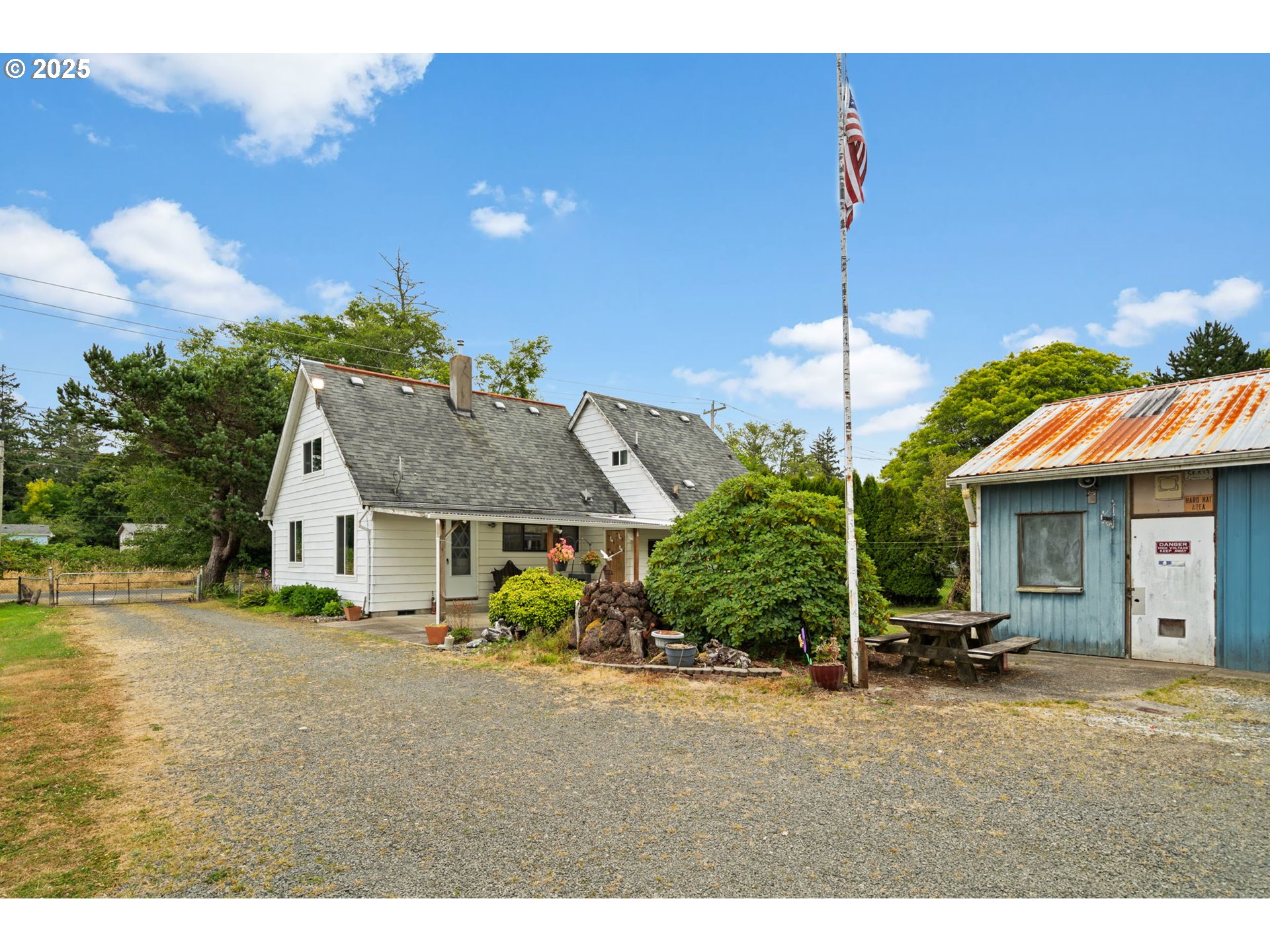 472 7th Avenue Hammond, OR 97121 - Photo 22 of 32 a house view with a garden space