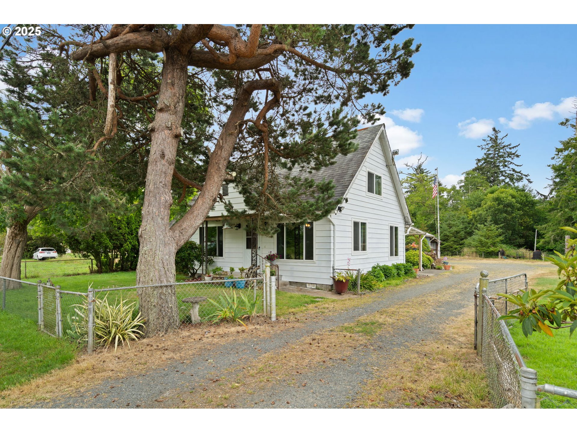 472 7th Avenue Hammond, OR 97121 - Photo 3 of 32 a front view of a house with a yard