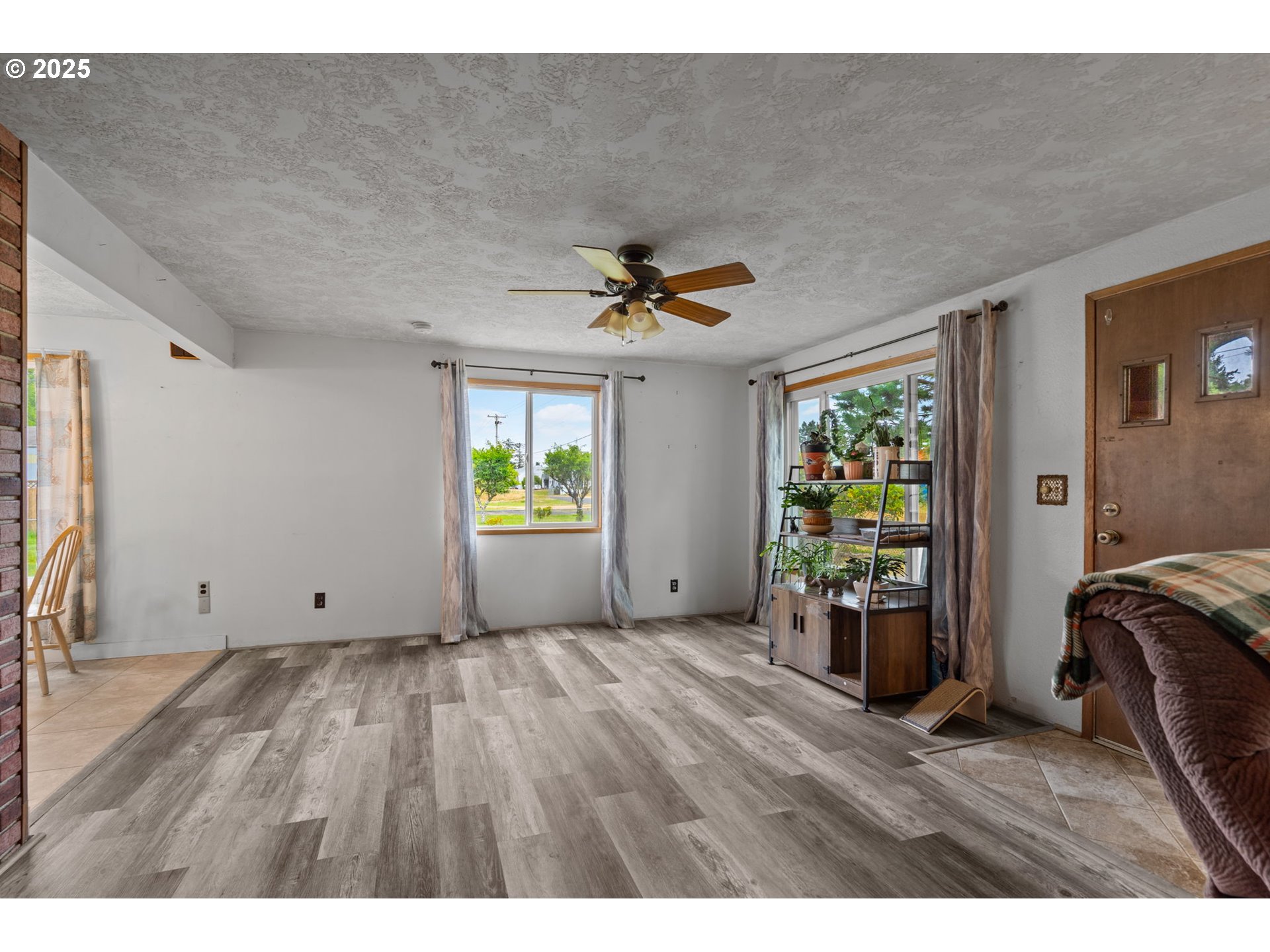 472 7th Avenue Hammond, OR 97121 - Photo 7 of 32 a view of an empty room with a window
