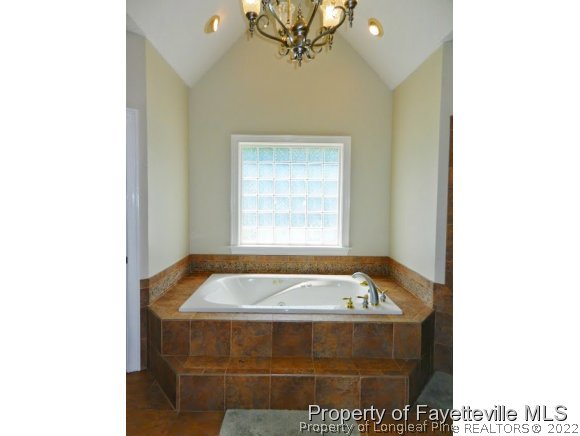1059 McGougan Road Lumber Bridge, NC 28357 - Photo 14 of 25 a bathroom with a tub