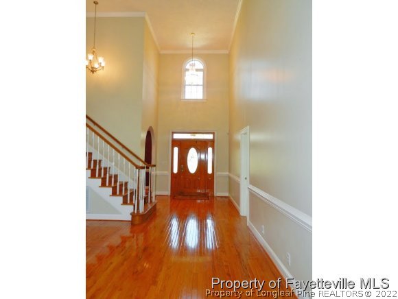 1059 McGougan Road Lumber Bridge, NC 28357 - Photo 7 of 25 a view of a hallway with wooden floor