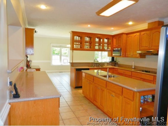 1059 McGougan Road Lumber Bridge, NC 28357 - Photo 10 of 25 a large kitchen with stainless steel appliances granite countertop a sink and cabinets