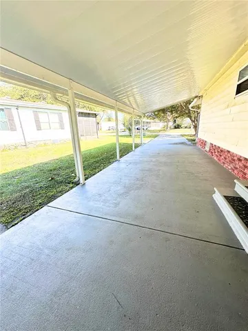 a view of a field with an trees