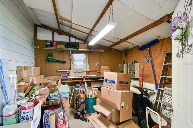 a view of an house with backyard and swimming pool
