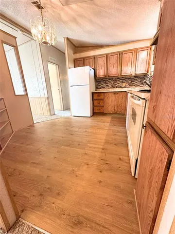 a view of a kitchen with furniture and a sink