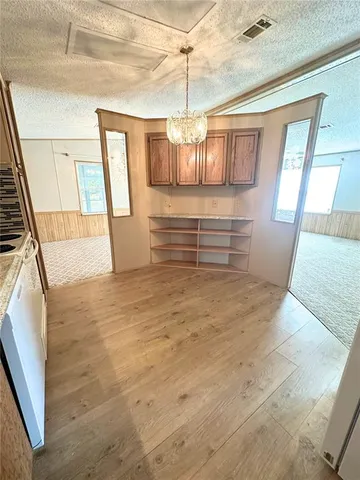 a open kitchen with stainless steel appliances granite countertop a stove and cabinets