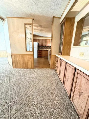 a kitchen with a refrigerator and a stove