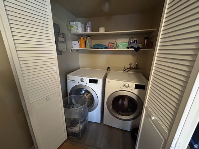 939 South Freedom Boulevard, Unit 13 Provo, UT 84601 - Photo 11 of 26 Laundry area with electric panel, washer and dryer, and dark wood-style floors