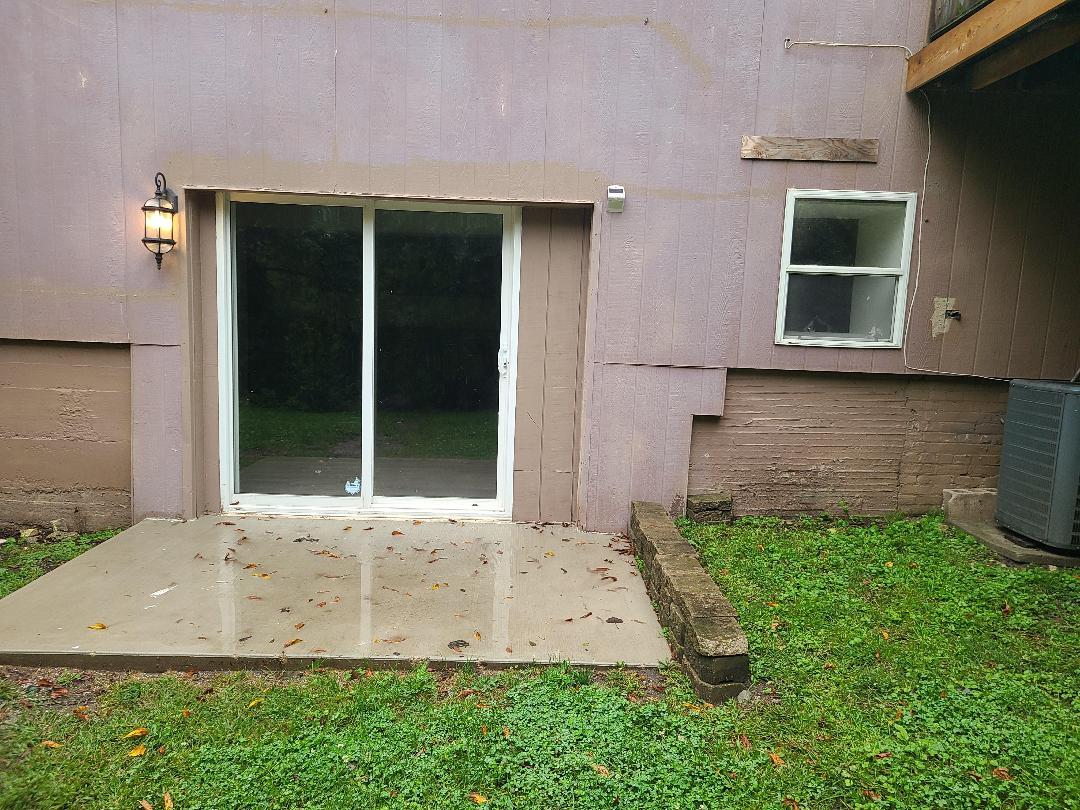 2103 Main Street, Unit L Spring Grove, IL 60081 - Photo 1 of 9 front view of a house with a yard