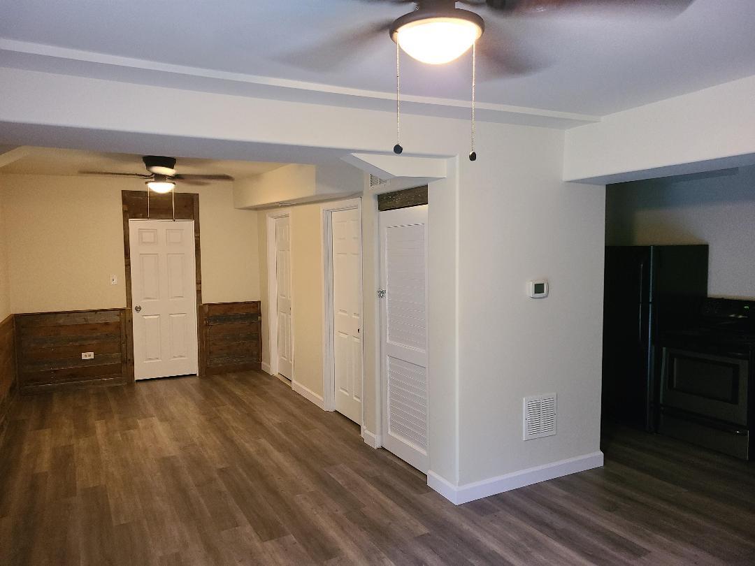 2103 Main Street, Unit L Spring Grove, IL 60081 - Photo 4 of 9 a view of a room with wooden floor