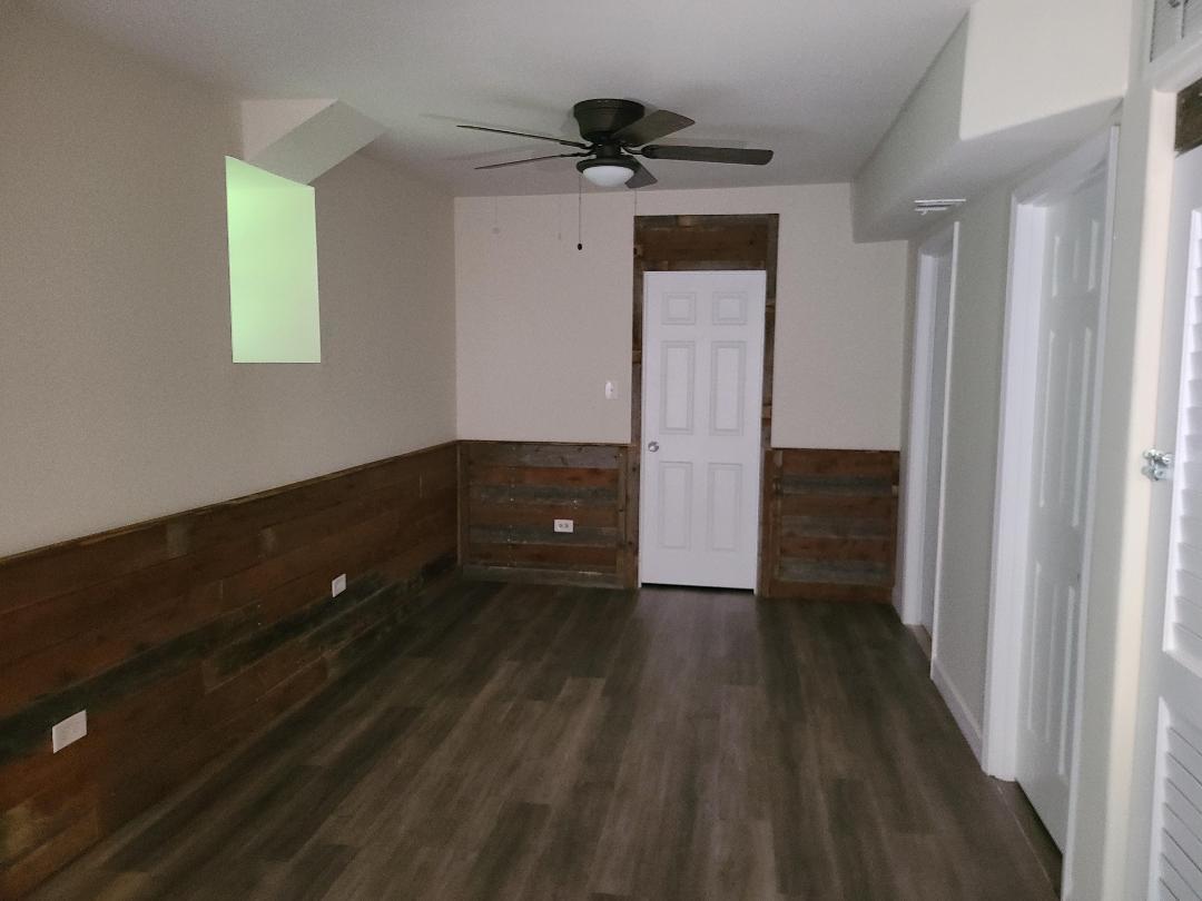 2103 Main Street, Unit L Spring Grove, IL 60081 - Photo 8 of 9 a view of a hallway with wooden floor and closet